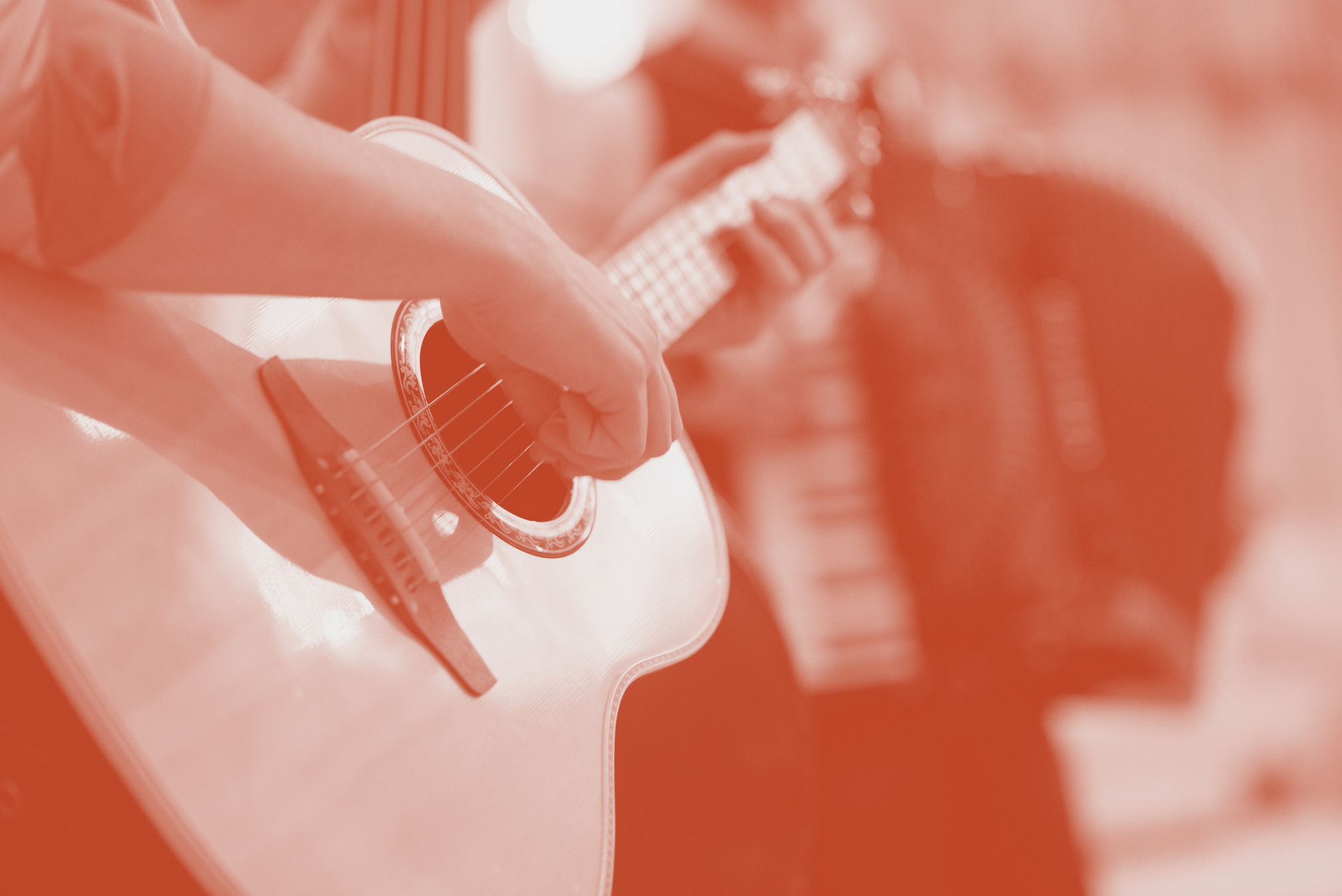 A close-up on a guitar being played